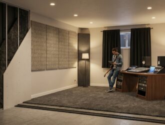 Soundproofed music room with acoustic panels, instrument setup and foam treatment