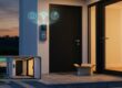 Smart video doorbell on front porch delivering live feed for home security.