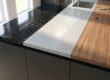 Selection of durable kitchen countertops: granite, quartz, marble, and laminate surfaces.