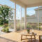 Spacious screened porch with cozy furniture, showing bug‑free view of garden and sky.