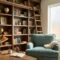 Cozy home library built‑in shelves with a comfortable reading nook and soft lighting.