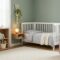 Serene nursery with soft neutral colors, sleek storage, and cozy crib for a calm baby room.