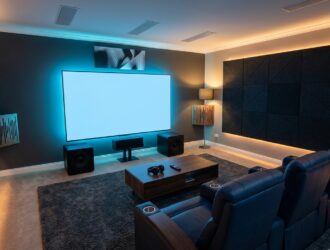 Home theater design with sleek speakers, plush seating, and stylish lighting