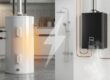 Tankless water heater beside traditional tank heater, illustrating cost & energy comparison.